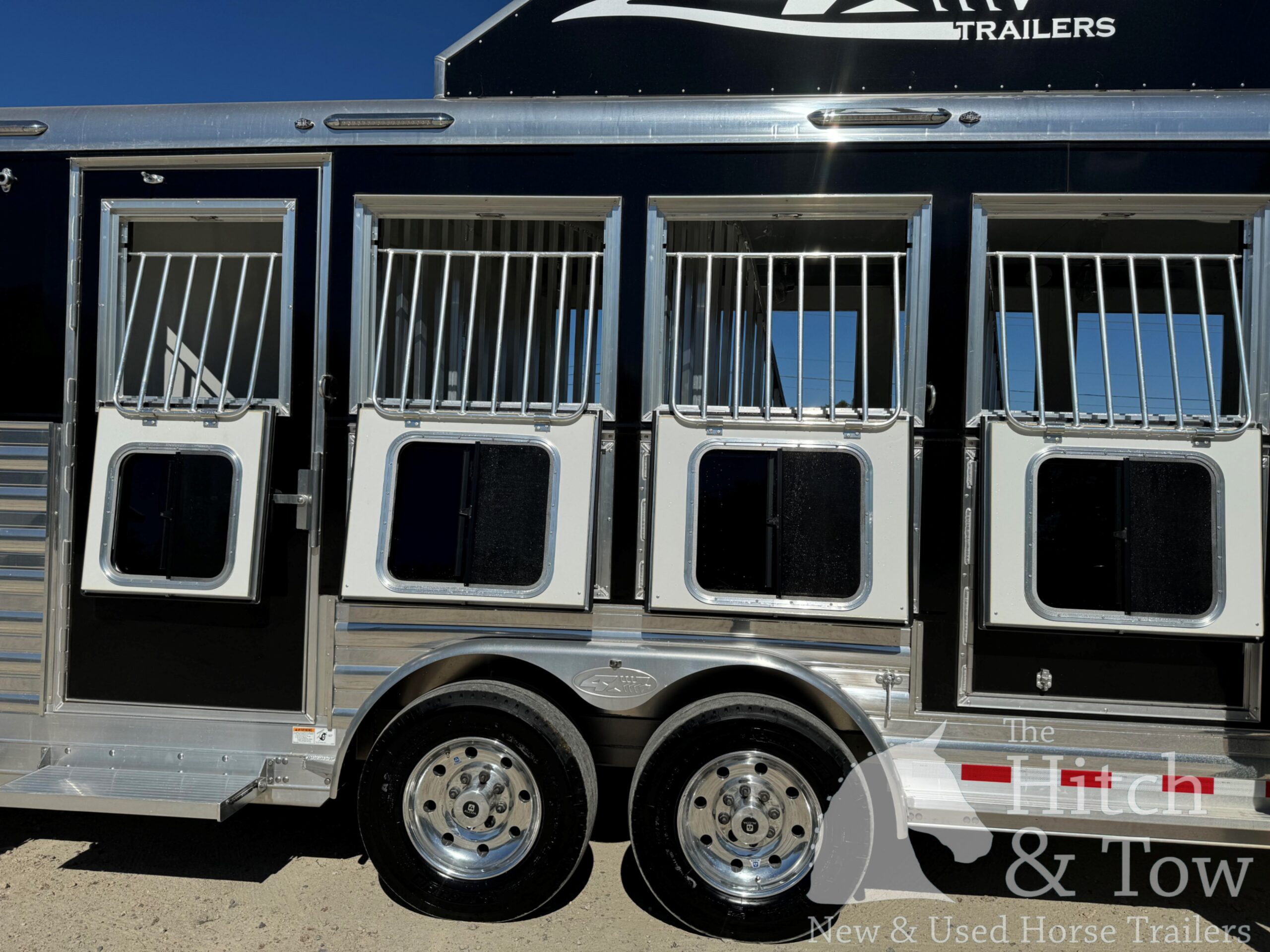 2023 4 STAR DELUXE 4 HORSE W/ 15′ OUTBACK LIVING QUARTERS, TONS OF UPGRADES, & TONS OF STORAGE!! $234,000