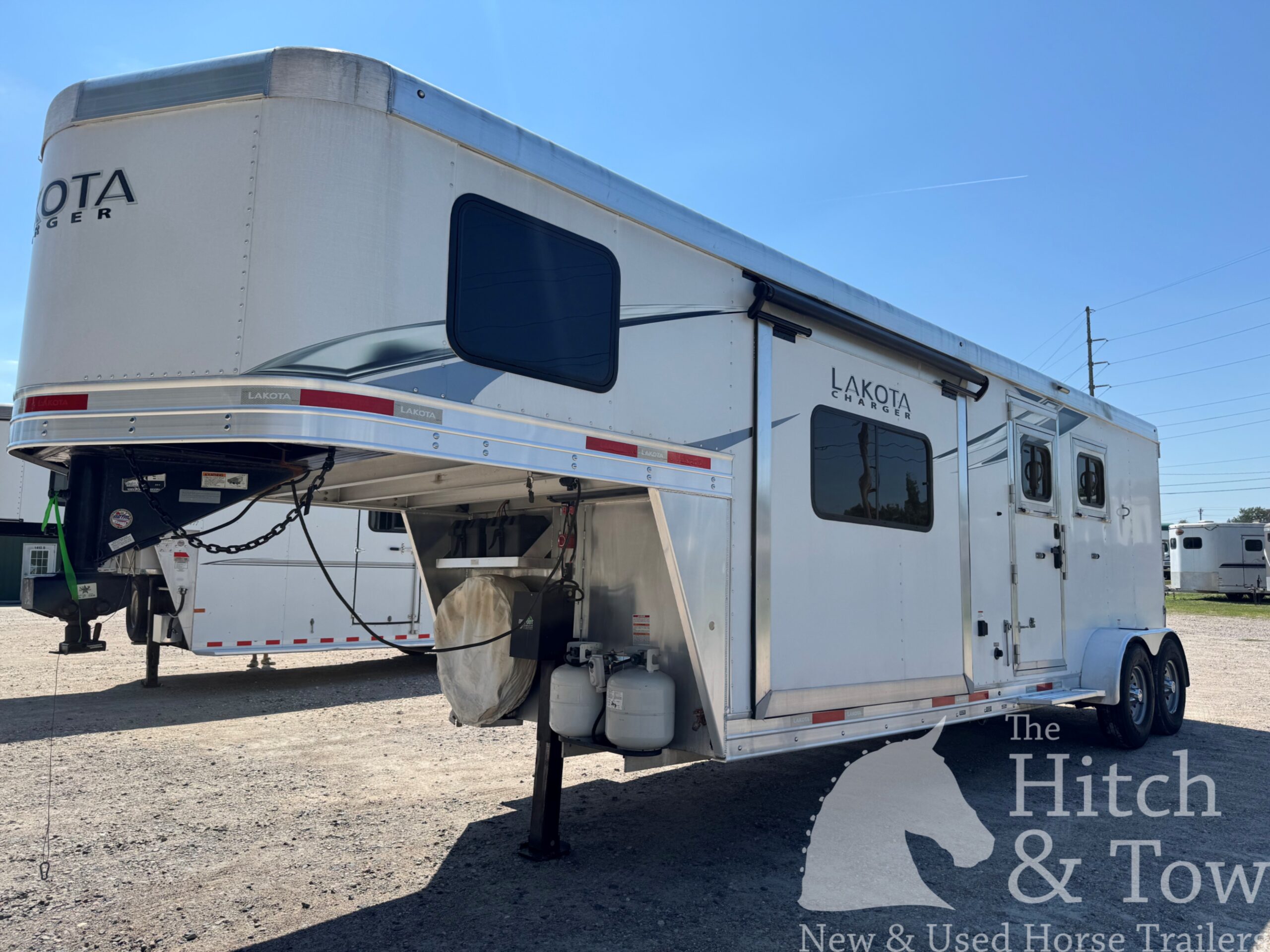 2021 LAKOTA CHARGER 2 HORSE GOOSENECK WITH 9′ LQ & 7′ SLIDE OUT! $52,500